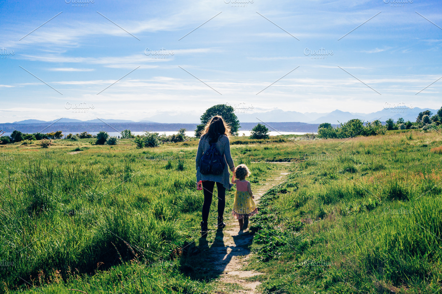 Mother and Daughter walking, a Nature Photo by Hello Goodbye Studio