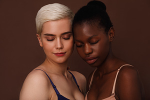 Two young women in lingerie standing, a Person Photo by Artem Varnitsin
