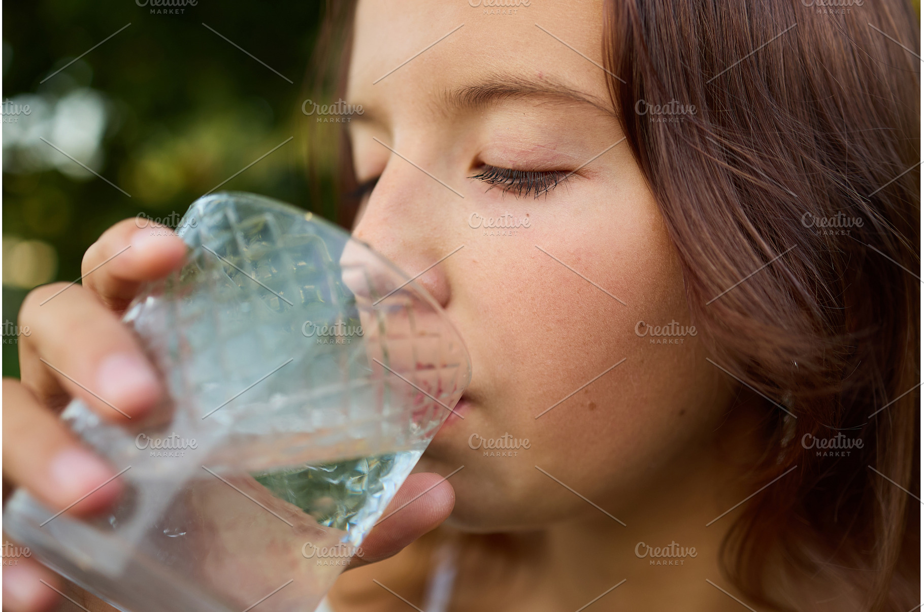 Girl drinks clear water from glass, a Nature Photo by IlliaBondarPhotography