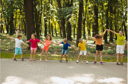 Kids playing outdoor team building, a Person Photo by oksix