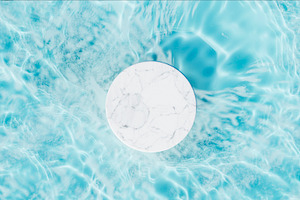 Marble podium in swimming pool water, an Abstract Photo by hitdelight