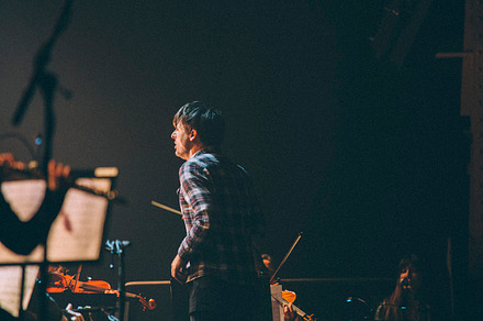 Modern conductor leads an orchestra