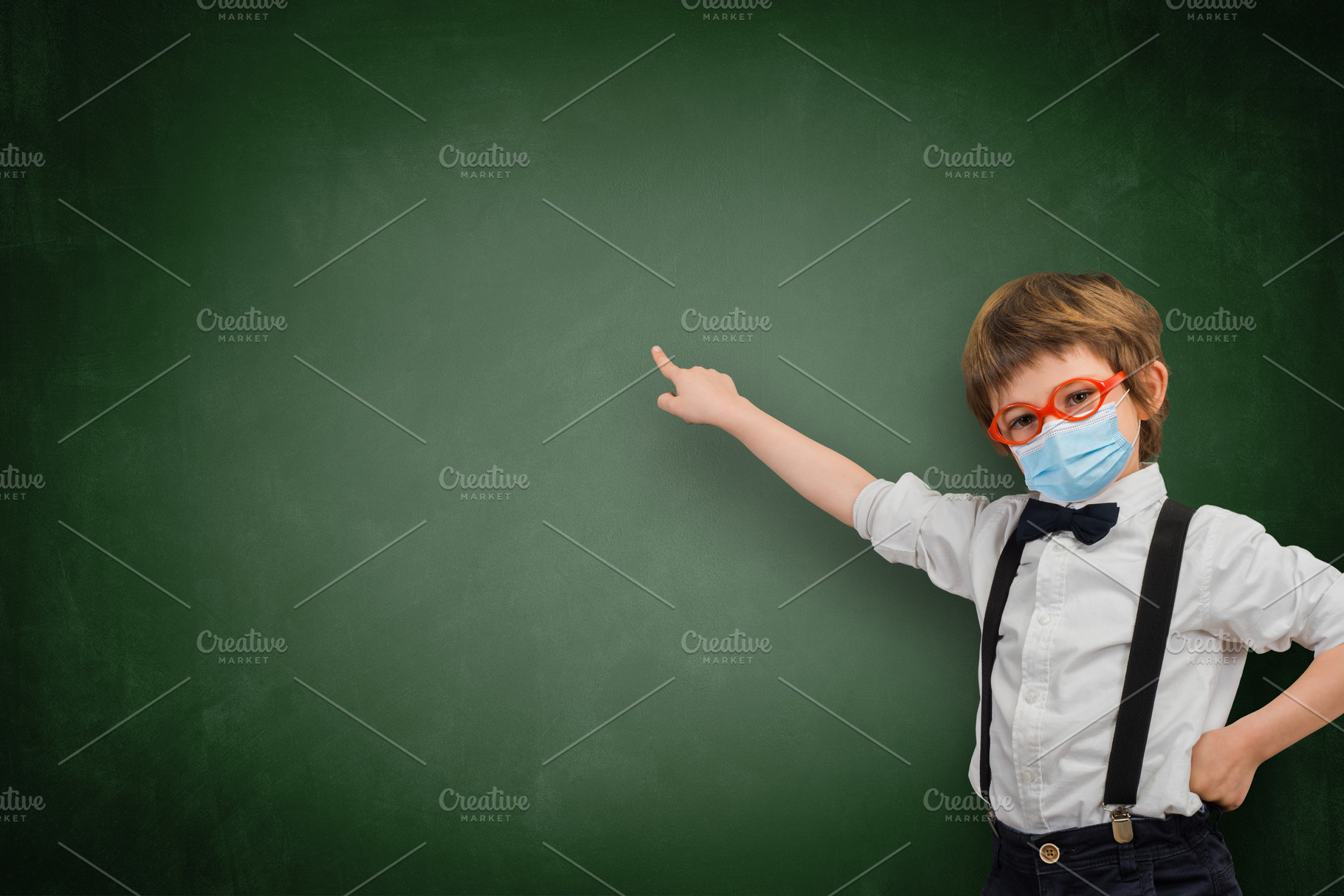 Child with sanitary mask points an e stock photo containing schoolboy and, a School & Education Photo by Claudio Valdés