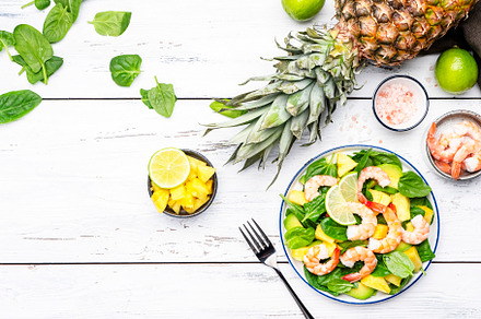 Shrimp pineapple salad with spinach, avocado and lime on white w, a Food & Drink Photo by 5PH