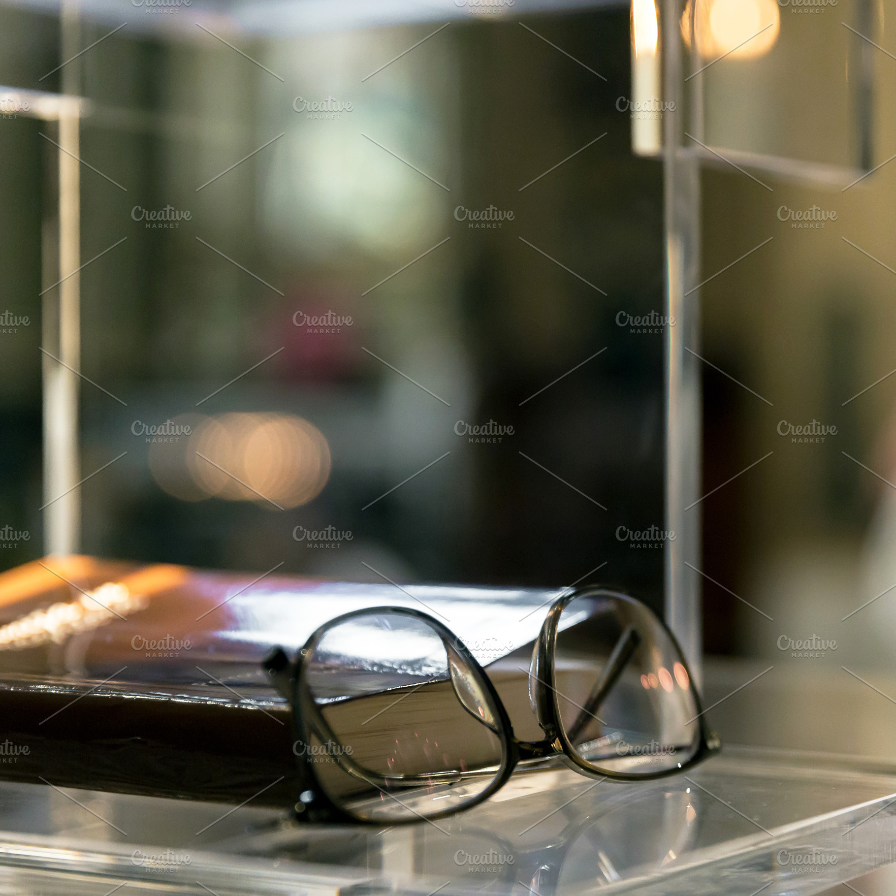 Book and glasses, a School & Education Photo by KYNA STUDIO