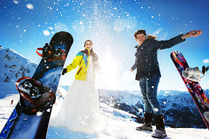 Newlyweds snowboarding