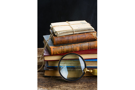 pile of books with looking glass, a School & Education Photo by Neirfy