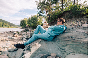 Man at the river Katun at summer day, a Person Photo by Jan Jack Russo Media