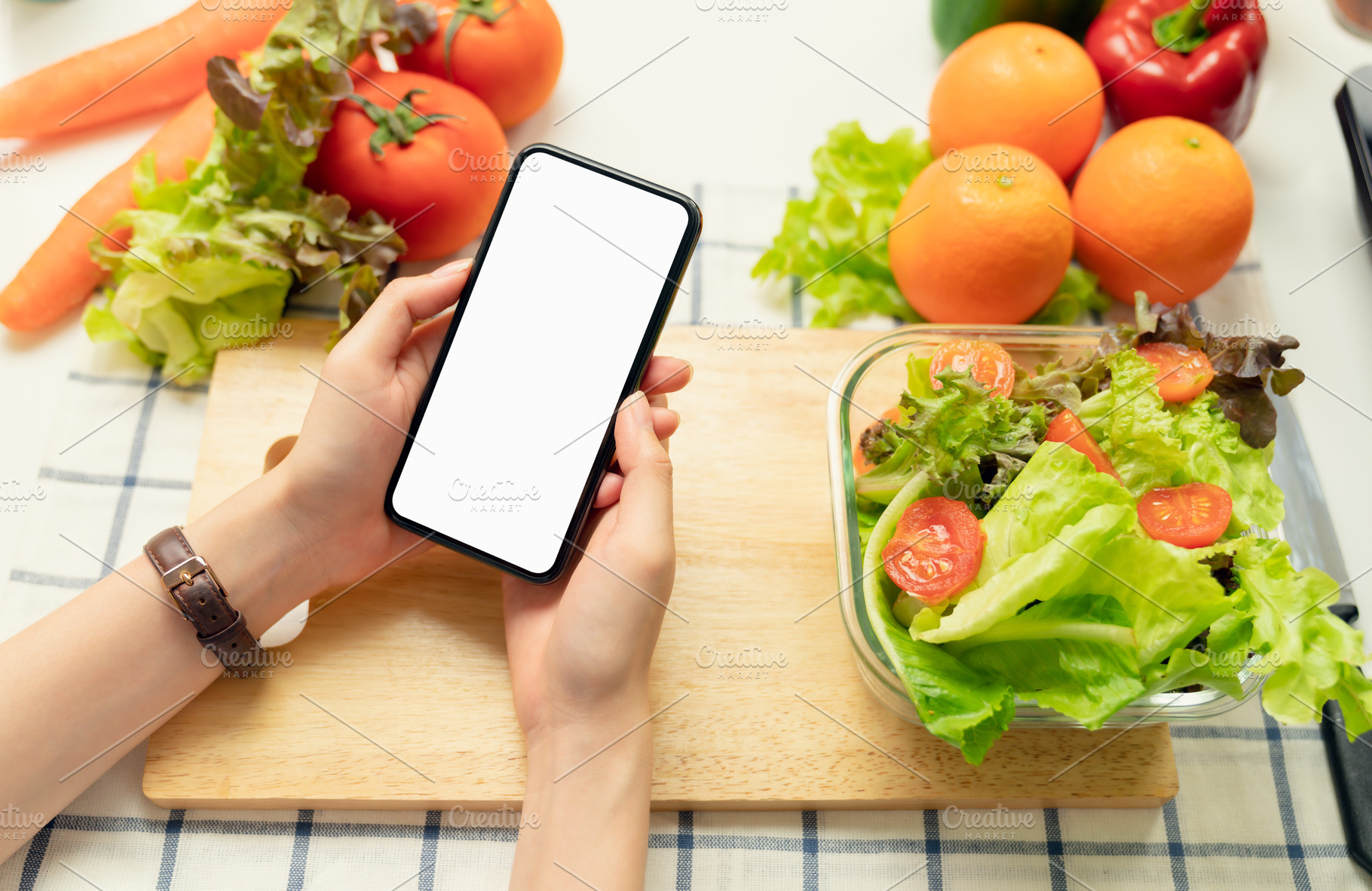 Woman hand holding a smartphone blan, a Food & Drink Photo by sitthiphong