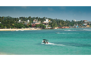 Dynamic Coastal View with Boats and, a Nature Photo by Our Amazing World