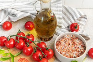 Fresh cherry tomatoes basil olive oil cooking ingredients, a Food & Drink Photo by Olena Rudo
