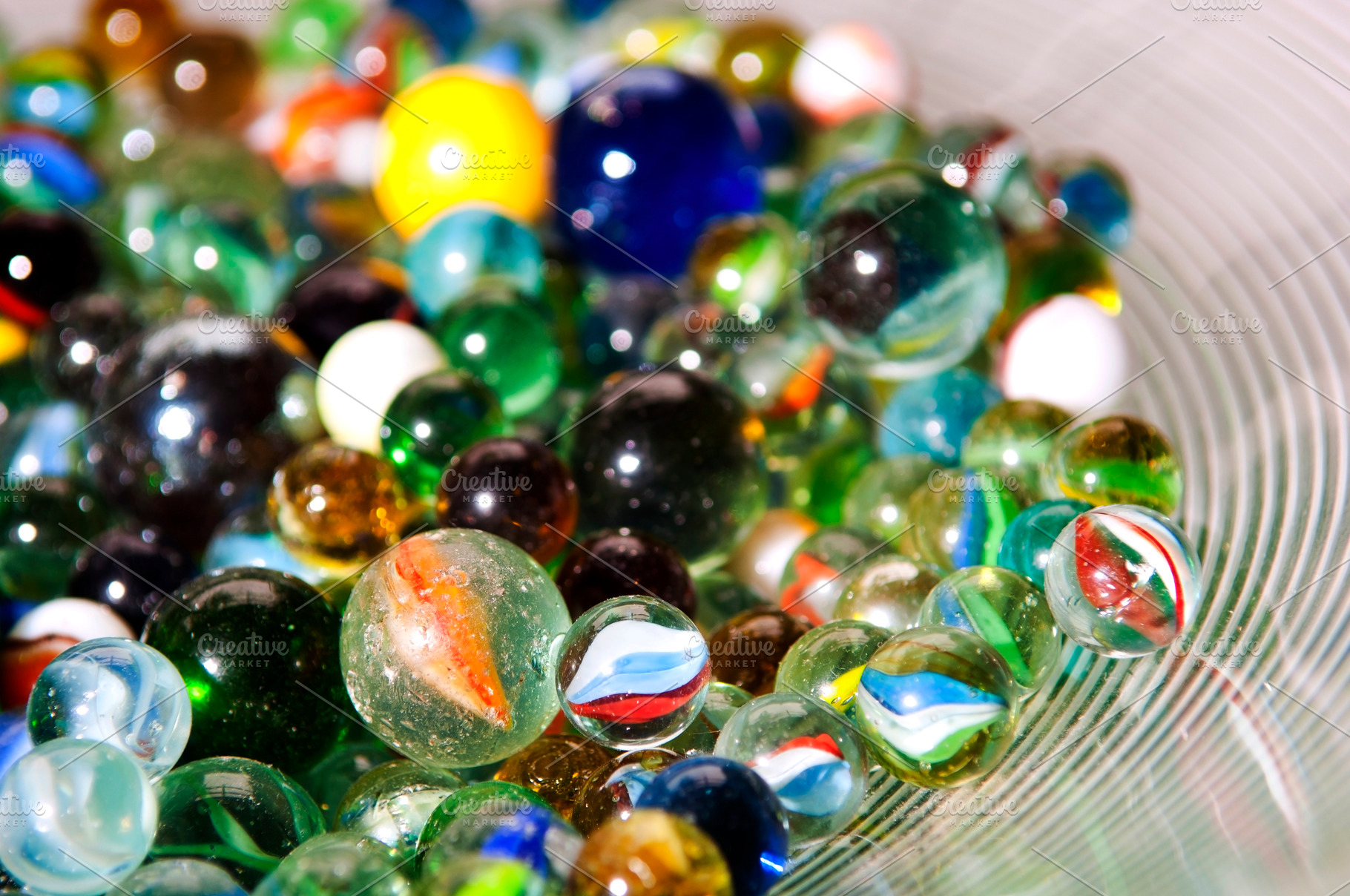 Stack of Marbles In Bowl, an Abstract Photo by THP Creative