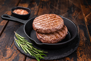 Deliciously charred grilled meat burger patty on the grill, perf, a Food & Drink Photo by composter-box@mail.ru