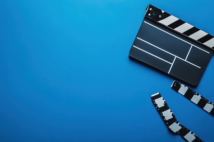Movie clapperboard positioned on a b, a Photo by Iftikhar Alam