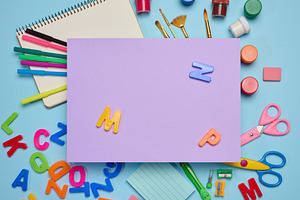 A rectangular sheet of lilac paper in the center, with school su, a School & Education Photo by ndanko