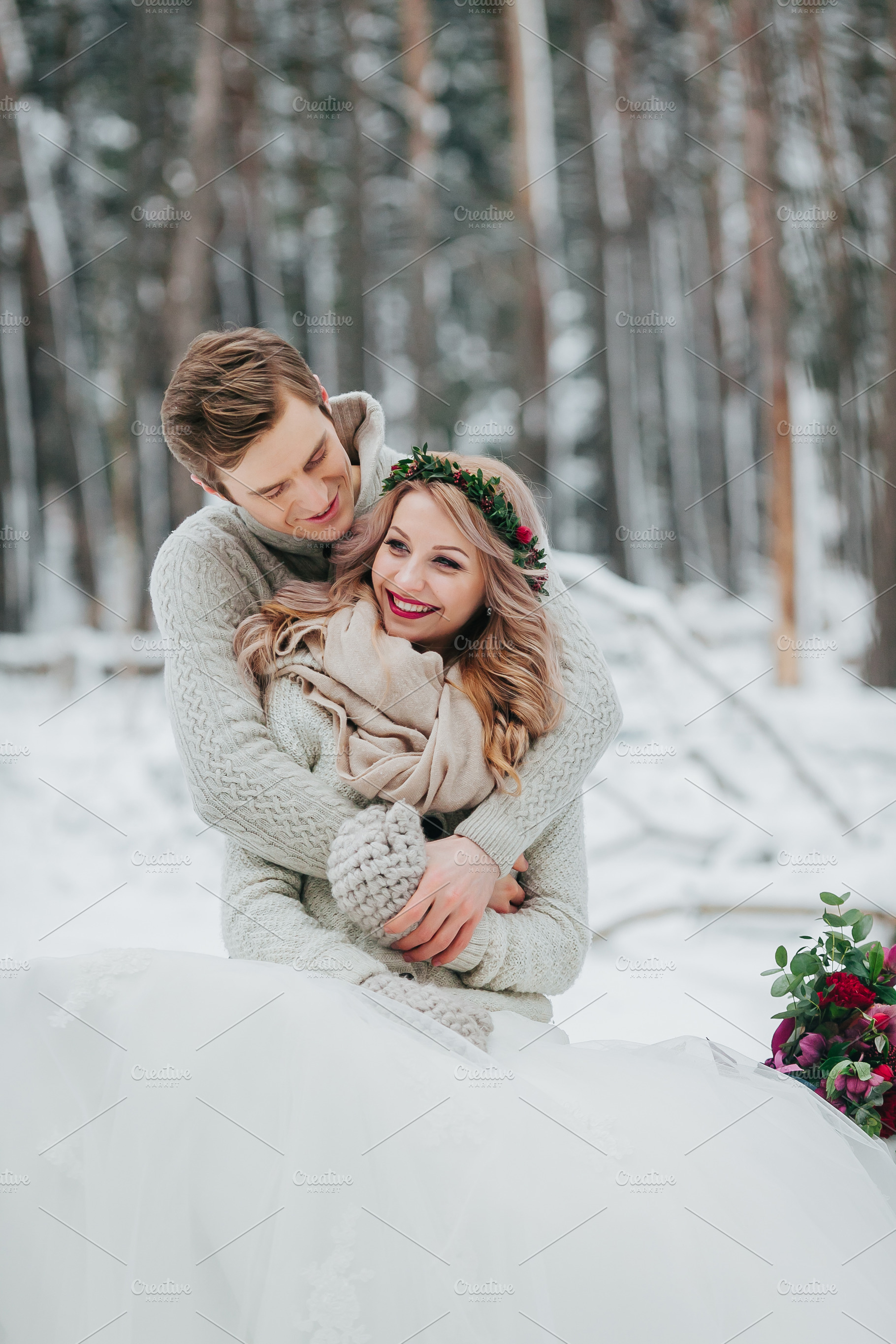 Happy newlyweds are hugging in the winter forest couple in love winter, a Person Photo by Stahov