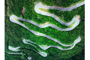 Aerial view of mountain curvy road, a Transportation Photo by den-belitsky