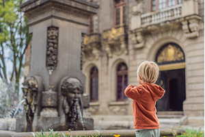 Little toddler tourist near, an Architecture Photo by Elizaveta Galitskaya