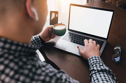Man working at laptop with coffee, a Technology Photo by Lenor4ik