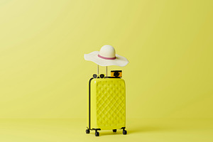 Yellow travel suitcase with summer hat and camera render, a Holiday Photo by RF Images