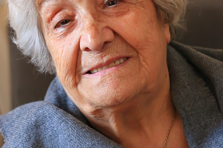 Portrait of a very elderly woman close-up. Positive ninety year old grandmother, a Person Photo by sabyna75