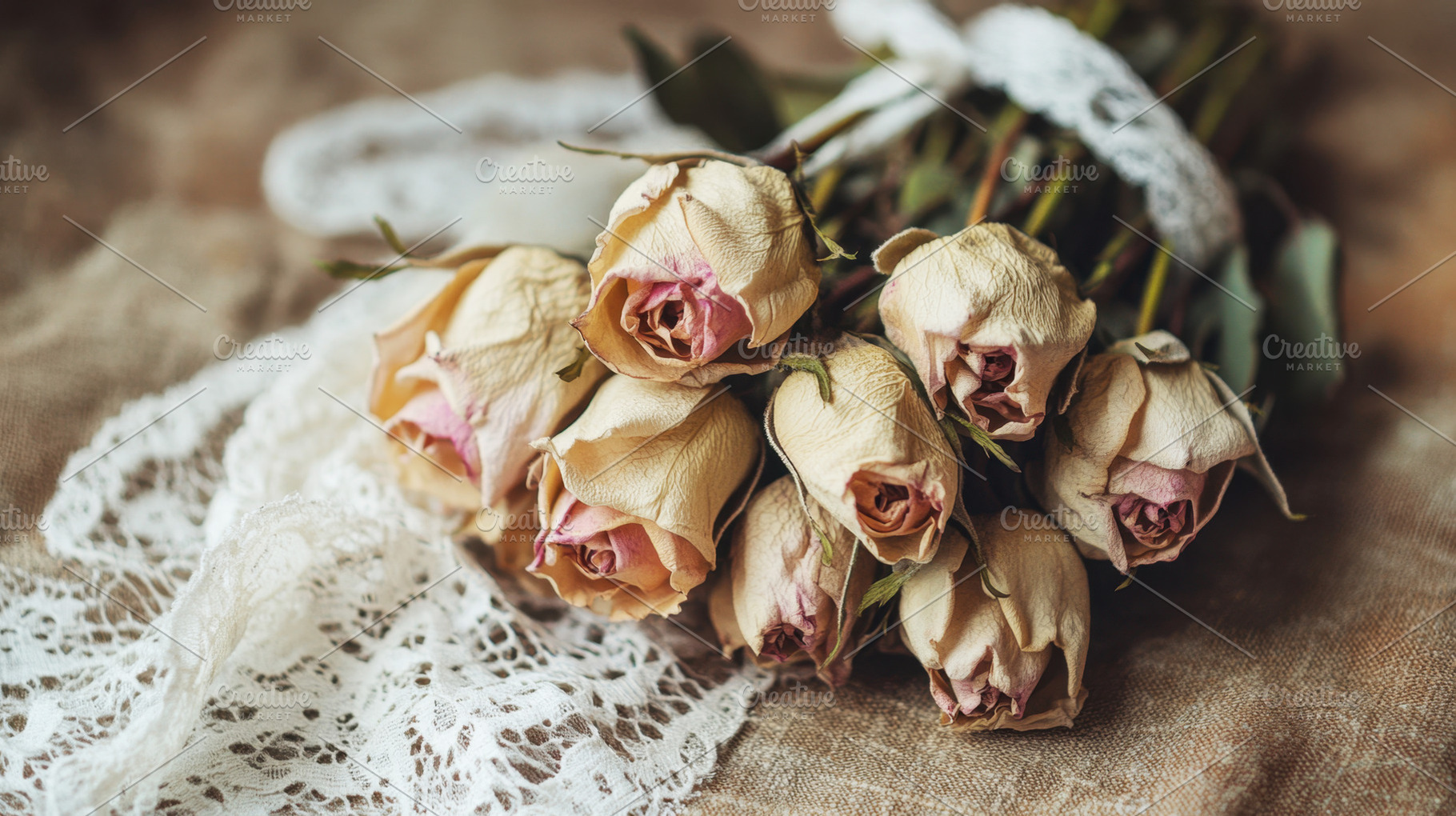Dried roses on textured surface, a Photo by Beautiful things