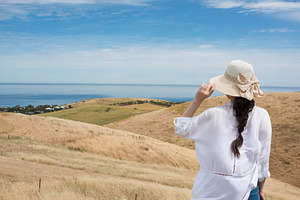 Woman looking at rolling landscape