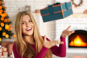 Happy woman catching a Christmas gift, celebrating winter holida, a Person Photo by Studio ANNA