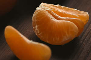 Tangerine segments peeled, showing the juicy fruit, a natural source of vitamin, a Photo by Studio ANNA