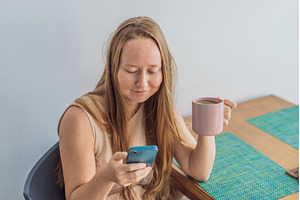 Woman enjoying a peaceful breakfast, a Person Photo by Elizaveta Galitskaya