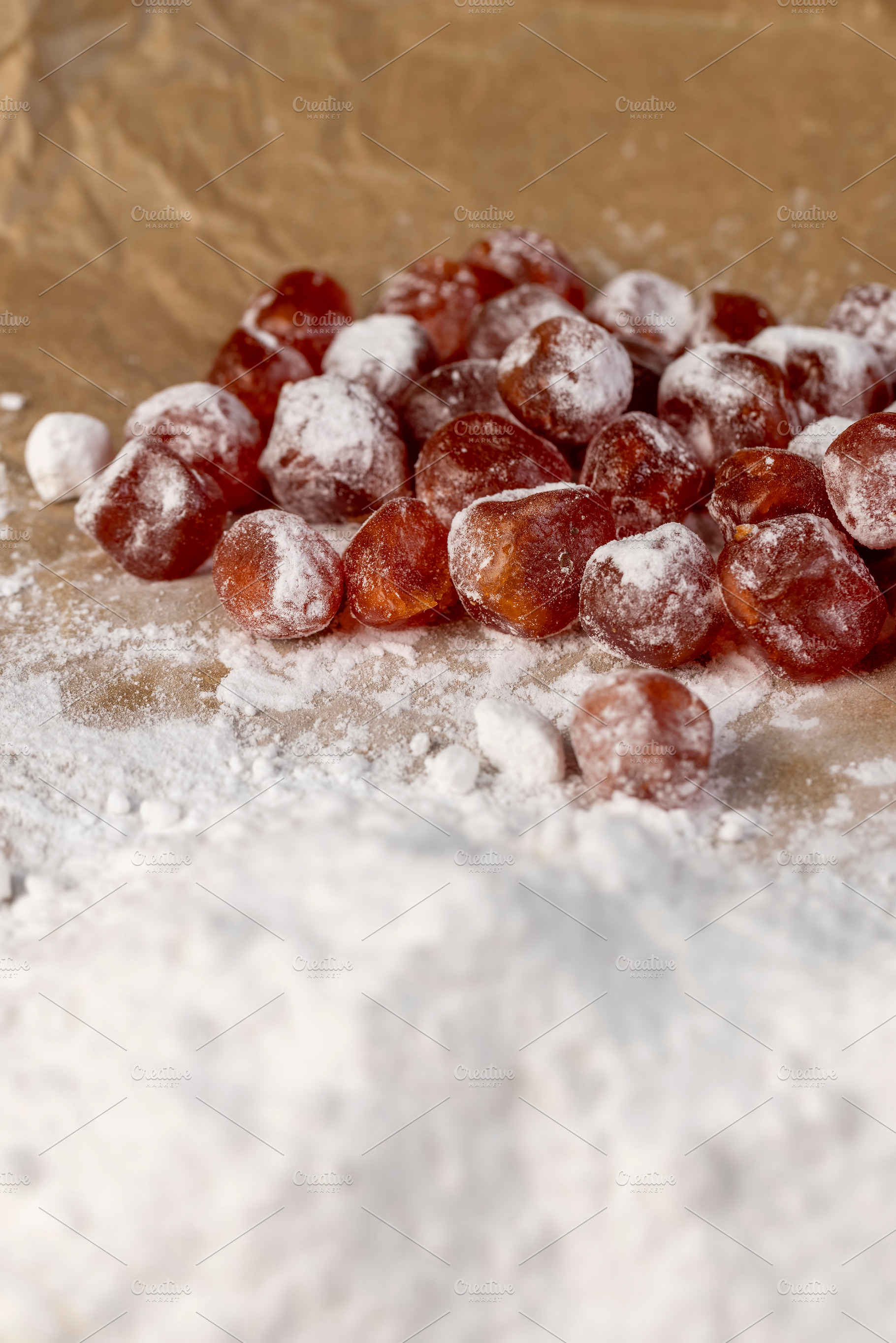 candied fruits of kumquat boiled in sugar syrup in powdered sugar, sweet dehydr, a Photo by MyPhotos