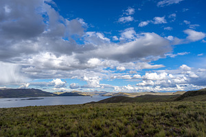 Storm clouds over Lake Lagunillas in the Peruvian highlands, a Nature Photo by GoodGoods