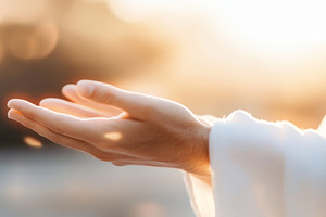 Hand of Jesus reaching out with light in spiritual scene, religi, a Photo by Dvoevnore photos