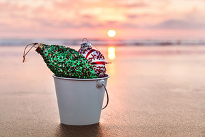 Christmas decorations featuring christmas, sunset, and beach