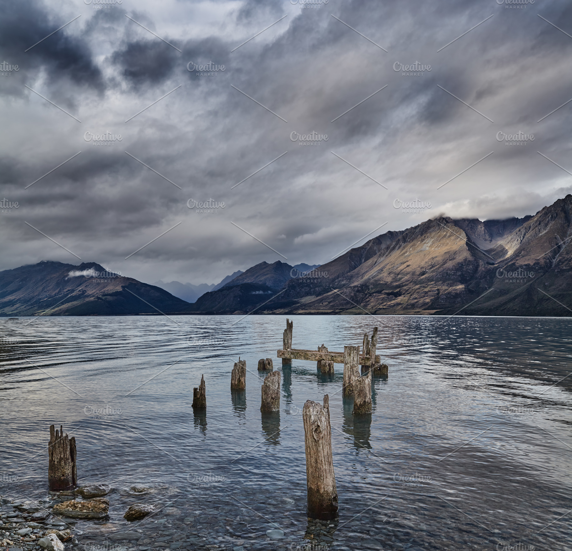 Mountain lake with old ruined pier, a Nature Photo by Shop Name