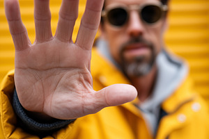 Man showing stop gesture, a Person Photo by MistyDay