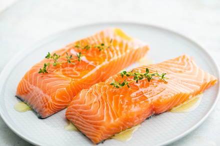 Fresh salmon fillet on a plate for delicious salmon steak.