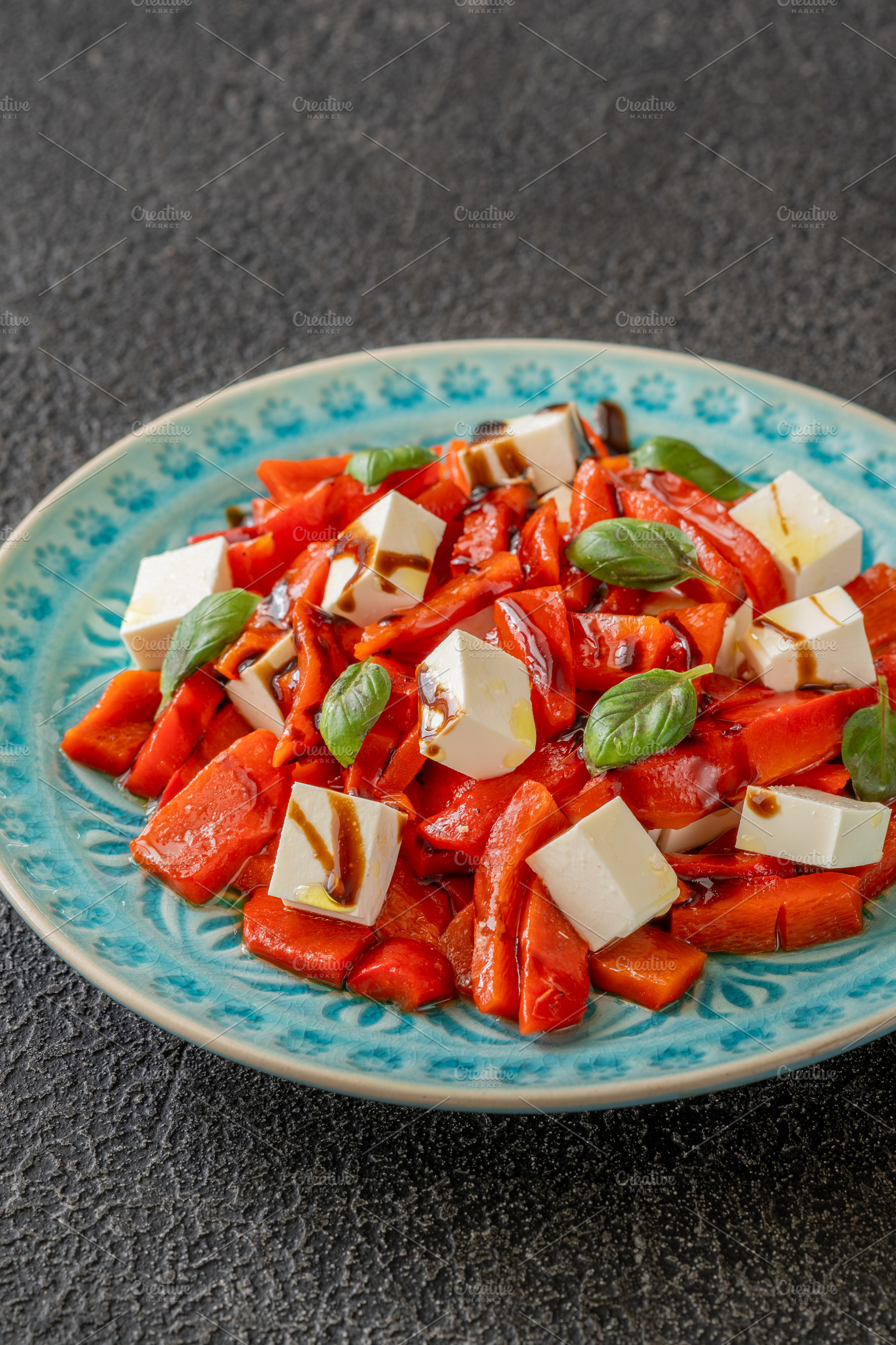 Mediterranean salad with roasted peppers feta basil and balsamic, a Food & Drink Photo by Alexander Prokopenko