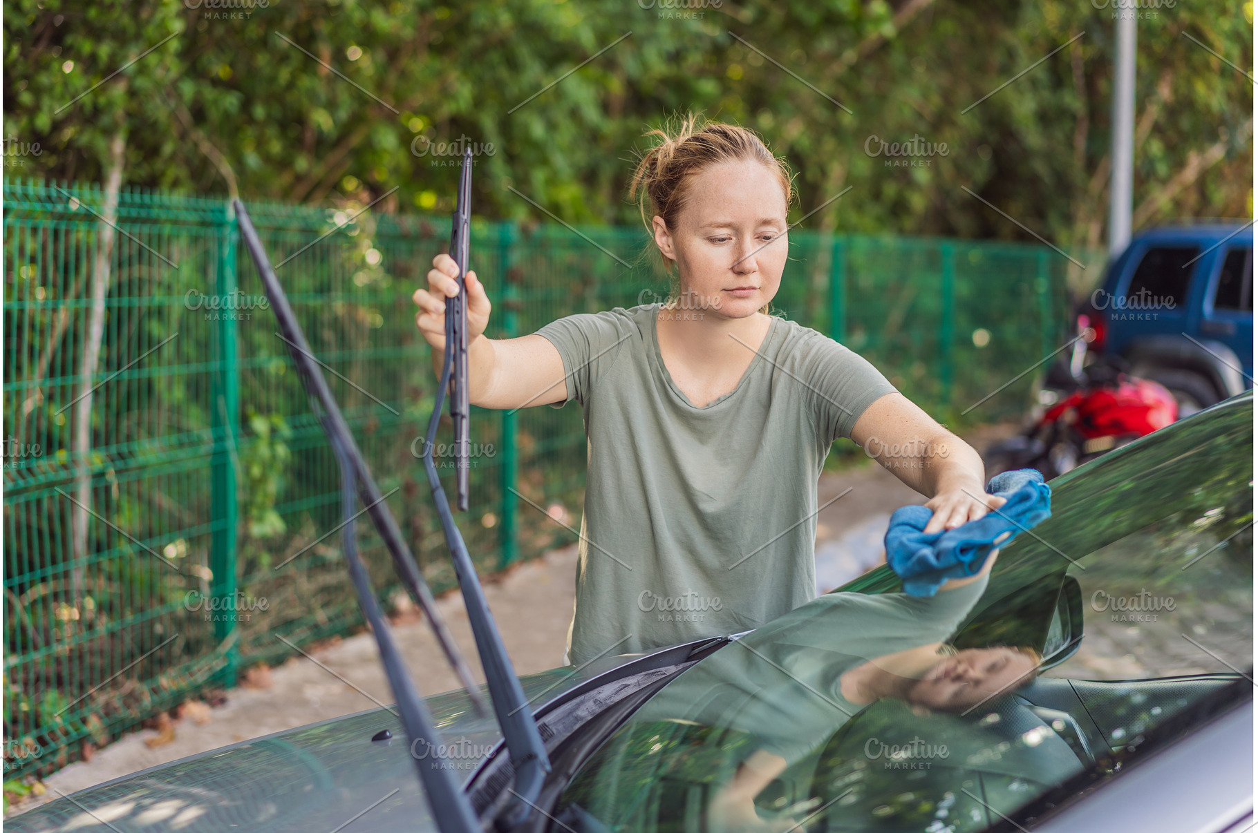 Woman cleaning her car, organizing, a Person Photo by Elizaveta Galitskaya