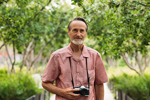 Portrait of an aged male tourist, a Person Photo by Artem Varnitsin
