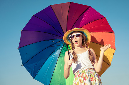 Teen girl with umbrella stock photo containing kid and beach