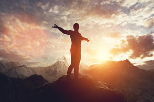 Man walking, balancing on mountain