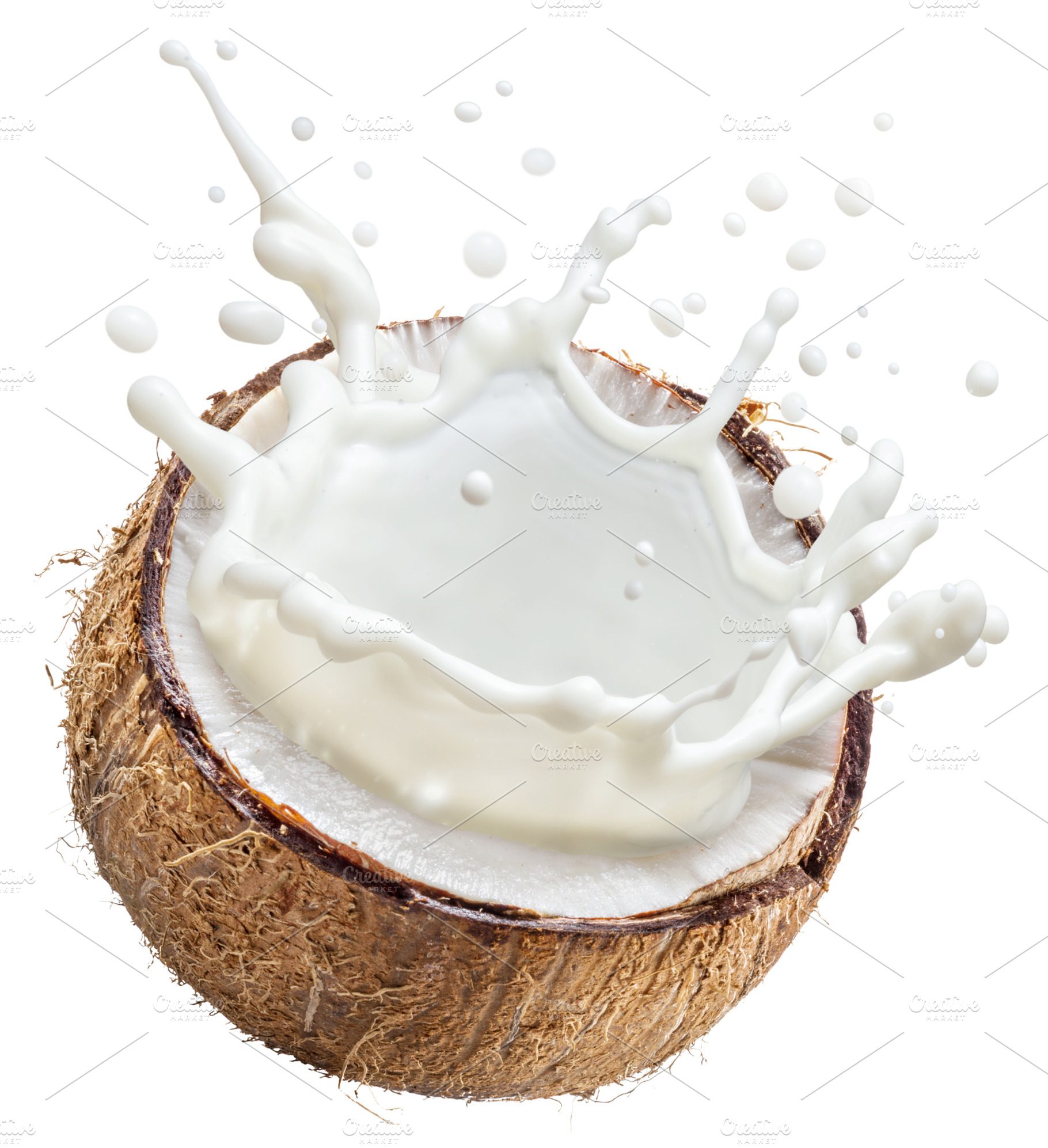 Coconut milk flying out from coconut, a Food & Drink Photo by Volff