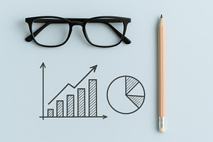 Glasses and pencil with chart drawin, a Photo by Dvoevnore photos
