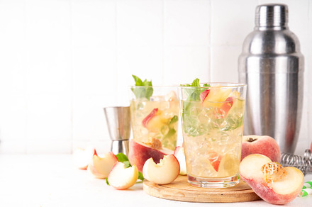 Flat chinese peach and lime lemonade, mojito cocktail