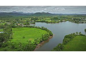 Lush green vegetation surrounding, a Nature Photo by Goinyk