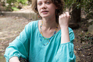 A young woman with expressive blue e, a Person Photo by Imaginarium