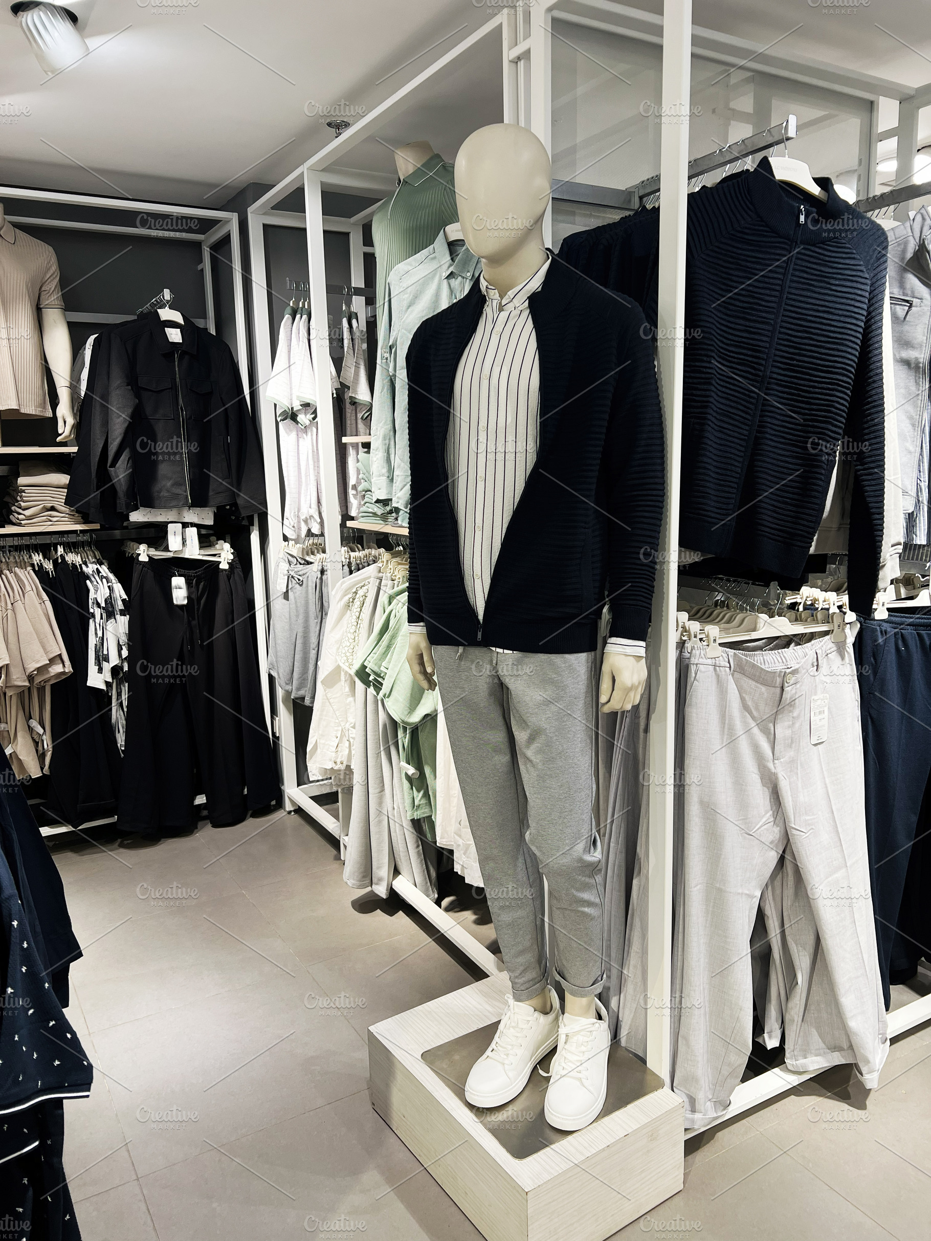 Mannequin wearing casual modern outfit in an elegant clothing store, a Photo by AS photostudio