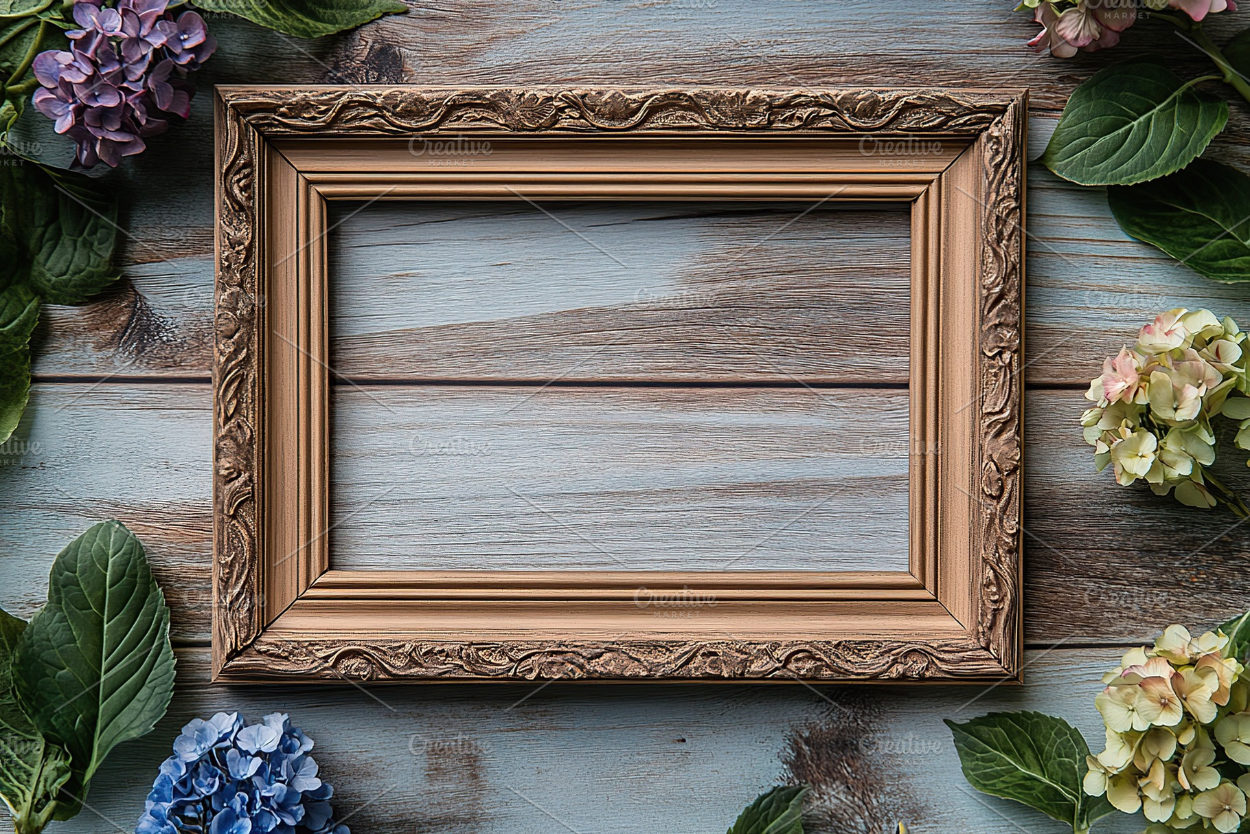 Flat lay photo of empty photo frame and spring flowers on wooden background, a Background Photo by AlyaAnd