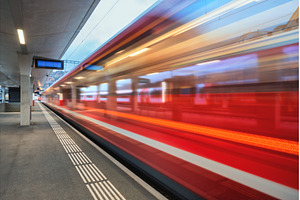 Blurred red passenger train passing, a Transportation Photo by den-belitsky